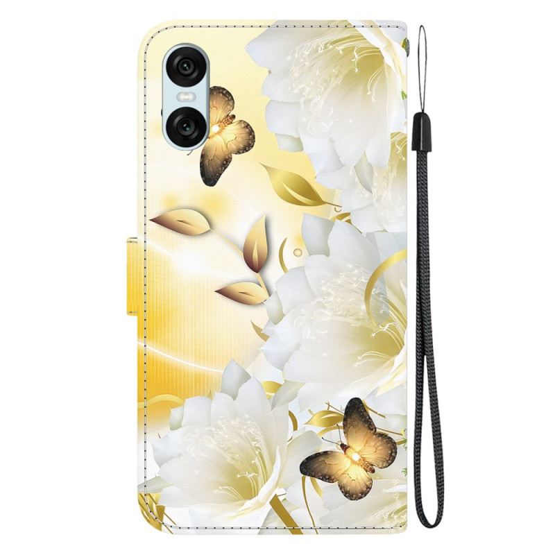 Lederhüllen Sony Xperia 10 Vi Goldene Schmetterlinge Und Weiße Blumen Mit Riemen