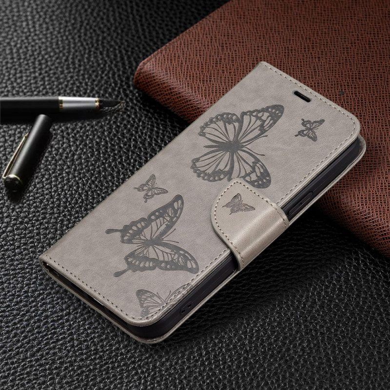 Flip Case Für Xiaomi 13 Mit Kordel Riemchen Mit Schmetterlingen-print