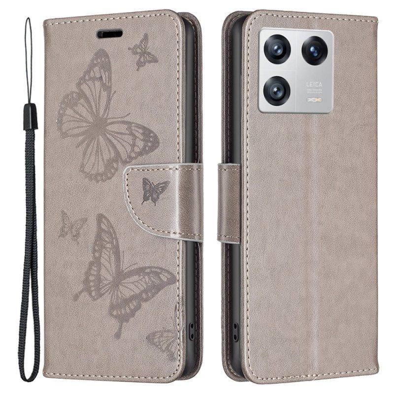 Flip Case Für Xiaomi 13 Mit Kordel Riemchen Mit Schmetterlingen-print